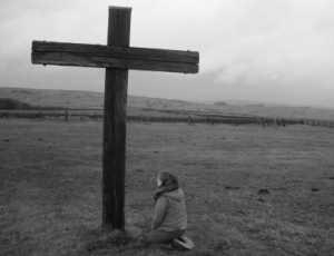 Woman Kneeling at Cross